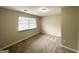 This bedroom has neutral walls, carpet flooring, and a window with blinds at 4305 Old Lake Dr, Decatur, GA 30034