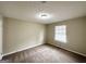 Bedroom with carpet, light walls, and a window letting in natural light at 4305 Old Lake Dr, Decatur, GA 30034