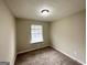 Bedroom with carpet, light walls, and a window at 4305 Old Lake Dr, Decatur, GA 30034