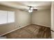 Bedroom featuring carpeted floors, a neutral color scheme, a ceiling fan, and a window with blinds at 4305 Old Lake Dr, Decatur, GA 30034