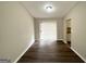 A dining room with wood-look flooring, a sliding glass door, and views of a neutral-colored wall at 4305 Old Lake Dr, Decatur, GA 30034