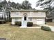 Two-story home with a combination of stone and siding, a front-facing garage, and an inviting entrance at 4305 Old Lake Dr, Decatur, GA 30034
