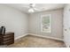 Cozy bedroom with ceiling fan, closet and view to the front yard at 6410 E Hills Ct, Cumming, GA 30041