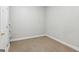 Neutral bedroom with wall-to-wall carpet and base molding at 6410 E Hills Ct, Cumming, GA 30041