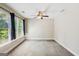 Spacious, bright bedroom with a ceiling fan and large windows at 6410 E Hills Ct, Cumming, GA 30041