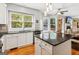 Spacious eat-in kitchen featuring island, stainless steel appliances, and bright windows at 6410 E Hills Ct, Cumming, GA 30041