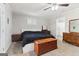 Cozy bedroom with ceiling fan and carpet, featuring an ensuite bathroom at 3345 S Highway 29, Moreland, GA 30259