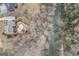 Stunning aerial perspective capturing a home, beautiful backyard oasis with a pool, and creek at 50 Red River Ct, Covington, GA 30014