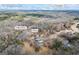Beautiful aerial view of a home near the Yellow River, surrounded by lush forest and other residences in Covington, GA at 50 Red River Ct, Covington, GA 30014