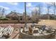Backyard with a fire pit, outdoor seating, and the house in the background at 50 Red River Ct, Covington, GA 30014