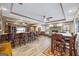 Finished basement with bar, brick accents, fireplace and ceiling fans, perfect for entertaining guests and relaxing at 50 Red River Ct, Covington, GA 30014