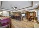 Finished basement with bar and brick accents, ideal for entertaining and relaxation, complemented by stylish flooring at 50 Red River Ct, Covington, GA 30014