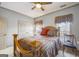 This comfortable bedroom includes a ceiling fan, double closet, and a nicely finished wood bed frame at 50 Red River Ct, Covington, GA 30014