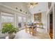 Bright breakfast nook featuring a table with seating, double doors to the deck, and ample natural light at 50 Red River Ct, Covington, GA 30014