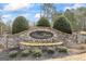 A stone sign for River Watch, a luxurious neighborhood with manicured landscaping at 50 Red River Ct, Covington, GA 30014