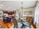 Inviting dining area featuring a glass-top table with seating for four, adjacent to the kitchen for convenient meals at 50 Red River Ct, Covington, GA 30014
