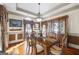 Charming dining room with coffered ceiling, hardwood floors, and natural light at 50 Red River Ct, Covington, GA 30014