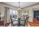 Cozy dining room featuring a glass-top table with seating for four and a large window offering natural light at 50 Red River Ct, Covington, GA 30014