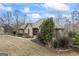 Exterior shot of a well-maintained brick house with mature landscaping at 50 Red River Ct, Covington, GA 30014