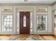 Foyer with hardwood floors, sidelight windows, and a decorative front door at 50 Red River Ct, Covington, GA 30014