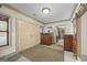 Inviting foyer area with double front doors and a view leading to an exercise room and other living areas at 50 Red River Ct, Covington, GA 30014