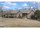 Charming one-story brick home featuring a well-manicured lawn and inviting entrance at 50 Red River Ct, Covington, GA 30014