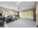 Spacious garage with ample storage and workspace, featuring a large door for easy access at 50 Red River Ct, Covington, GA 30014