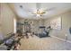 Well-equipped home gym featuring various exercise equipment and a ceiling fan for comfort at 50 Red River Ct, Covington, GA 30014