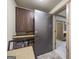 Hallway leading to the storage area with custom trim and flooring at 50 Red River Ct, Covington, GA 30014