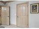 Hallway with a side view of two doors, custom flooring and trim at 50 Red River Ct, Covington, GA 30014