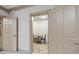 Hallway leading to a dinette area with custom trim and flooring at 50 Red River Ct, Covington, GA 30014