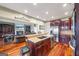 Gourmet kitchen seamlessly transitions into the living room, equipped with island seating at 50 Red River Ct, Covington, GA 30014