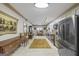 Bright, eat-in kitchen with stainless steel appliances, granite countertops, stylish cabinetry, and adjacent dining area at 50 Red River Ct, Covington, GA 30014