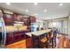 Open-concept kitchen overlooking the dining area with granite counters and stainless appliances at 50 Red River Ct, Covington, GA 30014