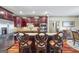 Modern kitchen with a large island, granite countertops, and stainless steel appliances at 50 Red River Ct, Covington, GA 30014