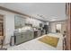 Modern eat-in kitchen featuring stainless steel appliances and stylish cabinetry, complemented by an elegant tile floor at 50 Red River Ct, Covington, GA 30014