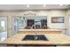 A gourmet kitchen with granite countertops and stainless steel appliances offers a luxurious cooking experience at 50 Red River Ct, Covington, GA 30014