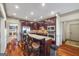 Well-lit kitchen featuring a center island with bar seating and stainless steel appliances at 50 Red River Ct, Covington, GA 30014