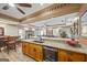 Open kitchen view showcasing granite countertops, custom cabinetry, and seamless flow into the adjacent living areas at 50 Red River Ct, Covington, GA 30014