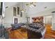 Open-concept room with hardwood floors and comfortable seating, offering a view into an adjacent kitchen area at 50 Red River Ct, Covington, GA 30014