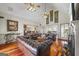 Spacious living room featuring high vaulted ceilings, hardwood floors, and comfortable leather seating at 50 Red River Ct, Covington, GA 30014