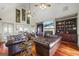 Spacious living room featuring vaulted ceilings, hardwood floors, fireplace, and stylish leather seating at 50 Red River Ct, Covington, GA 30014