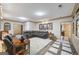 Large living room with a large leather couch set and custom wood trim at 50 Red River Ct, Covington, GA 30014