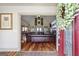 Living room with hardwood floors and brick fireplace, viewed through foyer at 50 Red River Ct, Covington, GA 30014