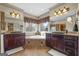 The main bathroom has dual sinks, a large soaking tub with a picture window, and a walk-in shower at 50 Red River Ct, Covington, GA 30014