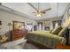 Spacious main bedroom boasts a fireplace, tray ceiling, and a large dresser with a decorative mirror at 50 Red River Ct, Covington, GA 30014