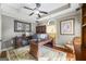 Office with tray ceiling, dark wood built-ins, desk, and chair at 50 Red River Ct, Covington, GA 30014