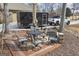 Inviting patio area with outdoor seating, landscaping, and a black trailer and pickup truck parked nearby at 50 Red River Ct, Covington, GA 30014