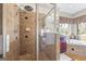 The main bath features a glass shower with a rainfall shower head, tile surround, and seamless glass door at 50 Red River Ct, Covington, GA 30014