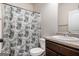 Functional bathroom featuring a decorative shower curtain and a vanity with a granite-style countertop at 121 Amelia Way, Ellenwood, GA 30294